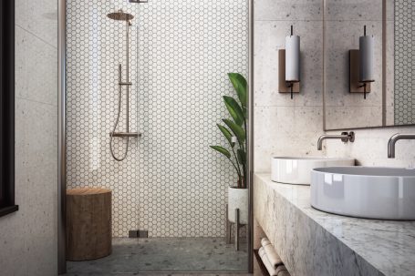 Moderne Badezimmeransicht mit Dusche, Doppelwaschtisch und Pflanzen.