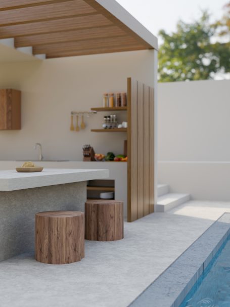 Moderne Außenküche mit Holzsitzen und Pool in einem ruhigen Garten.