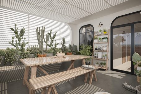 Heller Balkon mit Holztisch, Bänken und vielen Pflanzen in Töpfen.