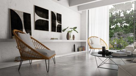 Modern Wohnraum mit stilvollen Möbeln und Kunstwerken, viel Licht und Pflanzen.